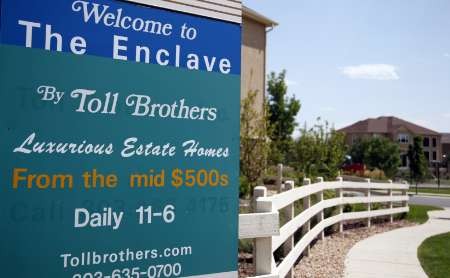 A sign is displayed at the entrance to a Toll Brothers housing development in Broomfield, Colorado