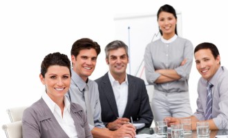 Portrait of multi-cultural business team during a presentation in a company
