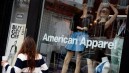 A woman looks at the American Apparel re