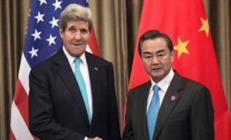 U.S. Secretary of State John Kerry (L) and Chinese Foreign Minister Wang Yi