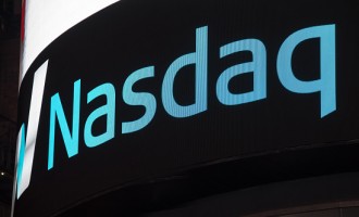 Nasdaq signage and logo on black background in New York City...